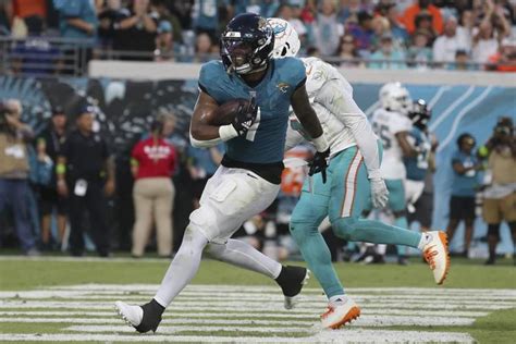 Dolphins player Daewood Davis carted off field after collision; preseason game vs. Jaguars halted